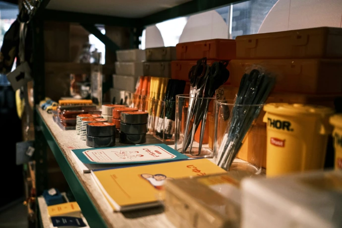 black and silver makeup brushes on clear glass container